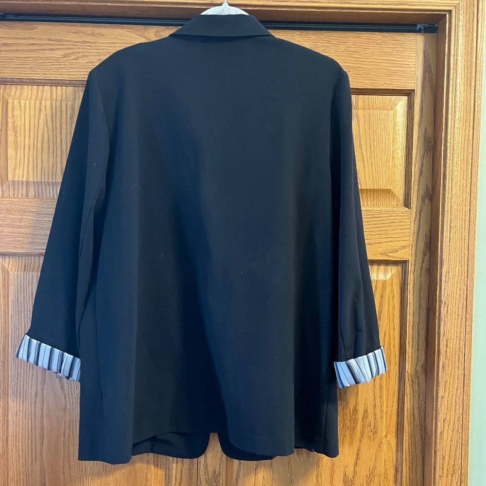 Black blazer with optional turn up cuffs. Size 16